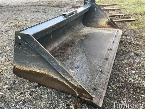 used 84 inch skid steer bucket|john deere 84 inch bucket.